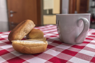 Breakfast on the table with checkered tablecloth