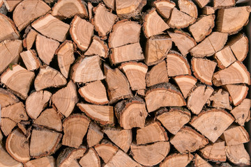 Wooden logs, beams, firewood. A lot of wood. Wooden log wooden background. Fuel. Harvesting...