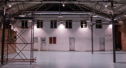 Empty city warehouse, industrial background with copy space. Bricklaying