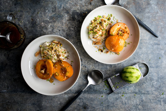 Overhead view of poached apricots with pistachio and amaretto mascarpone 