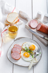 Sunny side up eggs with sausage and toast