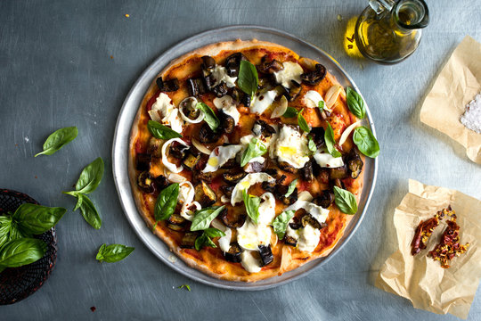 Overhead view of pizza served on plate