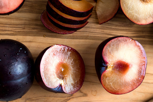 Close up of plums on wooden table