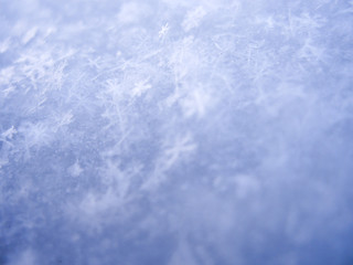 blurry blue background made of snowflakes