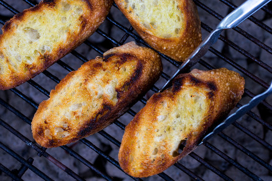 Close up of toast bread on barbecue grill