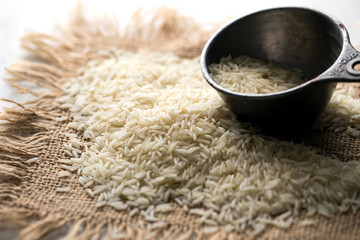 Close up of uncooked basmati rice on burlap