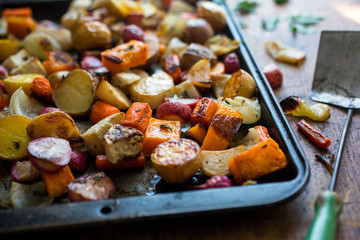 Close up of baked vegetables in baking tray