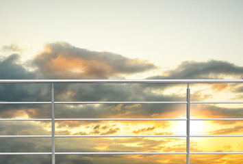 chrome fence, stainless steel fence, inox fence or alu fence. aluminum fence with sunset clouds sky background. 3D illustration