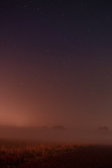 Fototapeta na wymiar Beautiful night view nature landscape with stars and fog environment in the countryside. Braunschweig, Germany