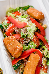 Cheese sticks with salad in a white box. Healthy food delivery. Take away for diet. Fitness nutrition, vegetables, meat and fruits in eco boxes. at wood and straw with copy space. series of photos