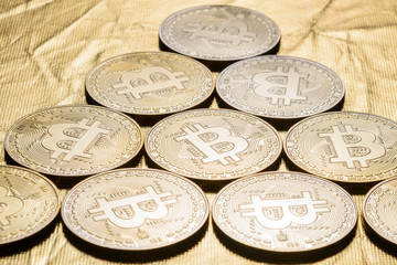 bitcoin coins on a gold background