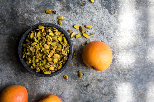 Overhead view of apricot and pistachios in bowl