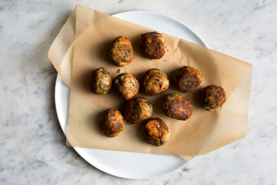 Overhead view of fried fish balls served on plate