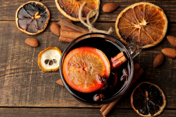 Hot mulled wine with cinnamon and orange in glass cups against a dark background. Christmas. new Year. view from above