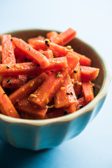 Carrot Pickle / Gajar ka Achar or Loncha in hindi. Served in a bowl over moody background....
