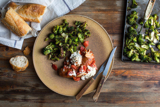 Overhead view of sausage with broccoli served on plate