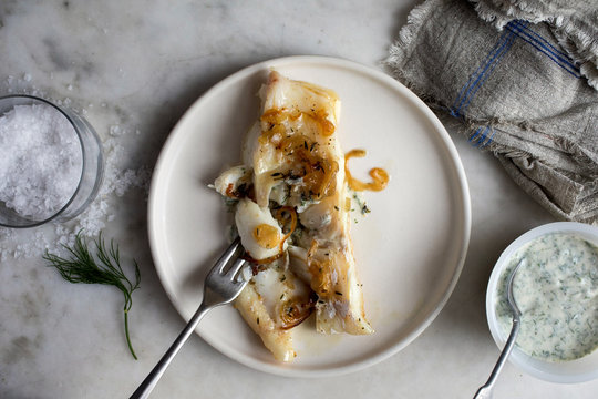 Close up of cod fish served on plate 