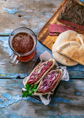 Pastrami beef sandwich wit coleslaw salad, copy space.