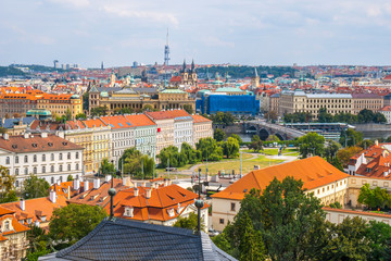 Fototapeta na wymiar View over historic center of Prague with castle Prague city panorama, red roofs of Prague, Czech Republic
