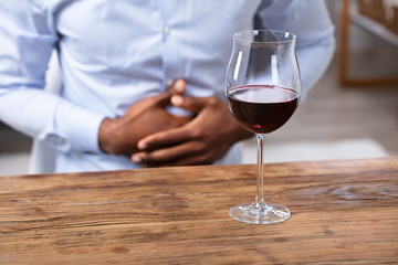 Glass Of Wine On Wooden Desk