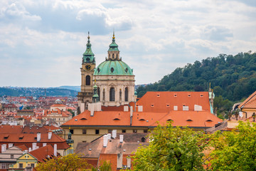 View over historic center of Prague, St. Nicholas Church, red roofs of Prague,  Czech republic
