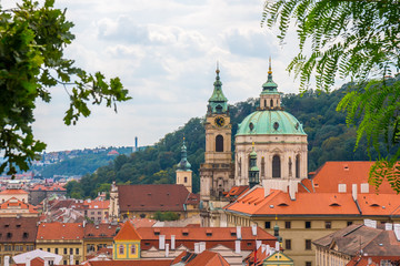 View over historic center of Prague, St. Nicholas Church, red roofs of Prague,  Czech republic