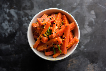 Carrot Pickle / Gajar ka Achar or Loncha in hindi. Served in a bowl over moody background....