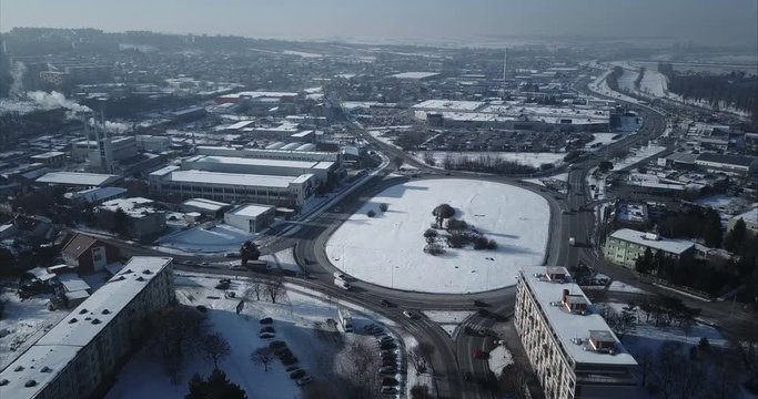 Flying towards big roundabout in Nitra City, Winter, Aerial shot, Slovakia
