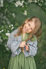 Portrait of a little girl in spring in flowering trees 1808.