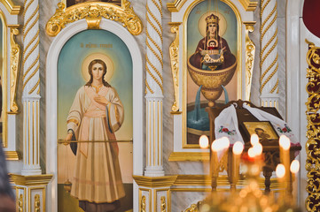 Burning candles for health in the Church near the icon 1839.