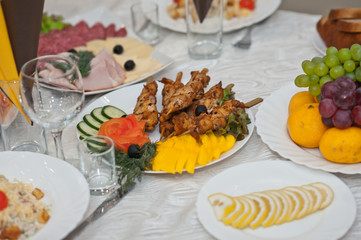 Decoration of the wedding table with various treats 1860.