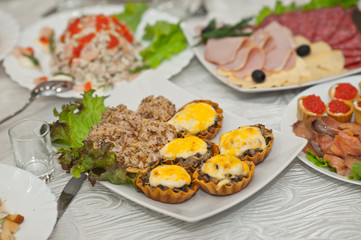 Decoration of the wedding table with various treats 1861.
