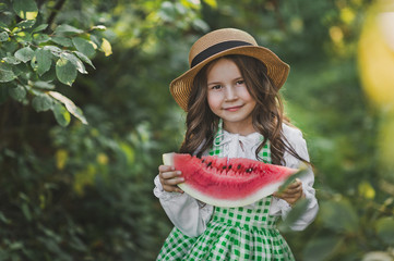 A happy child eats a juicy slice of watermelon 1897.