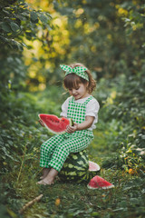 Smiling child with a piece of juicy watermelon in his hands 1899.
