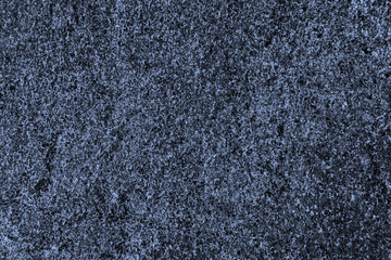 Surface of natural dark blue stone, granite, background, texture
