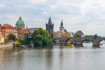 Fototapeta na wymiar View of the Old Town pier architecture and Charles Bridge over Vltava river in Prague, Czech Republic