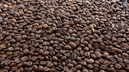 Coffee beans on the table background blurred abstract blurred