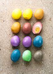 Fototapeta na wymiar Peeled Colorful Easter eggs background, top view.
