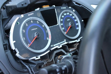 The dashboard of the car, the speedometer close-up.Repair of the car, disassembled the panel, the...