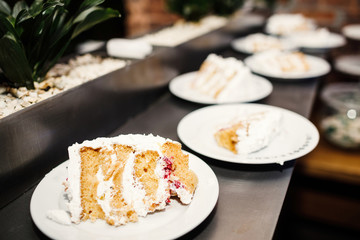 Wedding catering, table with modern desserts and cupcakes.