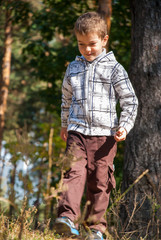 Boy on a walk in the forest 