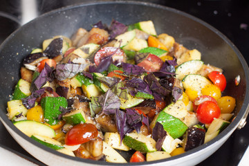 Chopped vegetables braising in frying pan