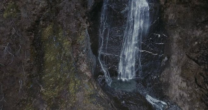 Aerial shot of waterfall in Norwegian wilderness