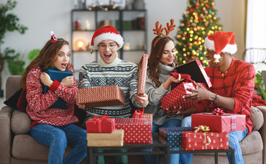 company of happy friends celebrating Christmas and New Year