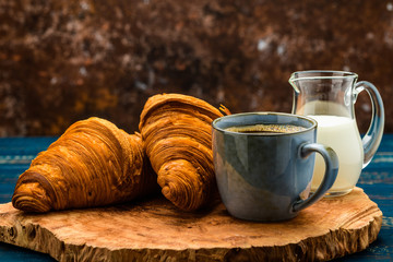 French coffee with cream and Eclair and coffee beans