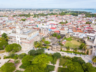 Fototapeta na wymiar The House of Wonders. The Old Fort (Arab Fort built by Sultan of Oman). Stone Town, old colonial center of Zanzibar City, Unguja island, Tanzania. Aerial done photo.