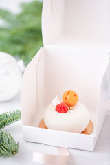 Mini mousse pastry dessert covered with white velour. Individually wrapped in white box. The...