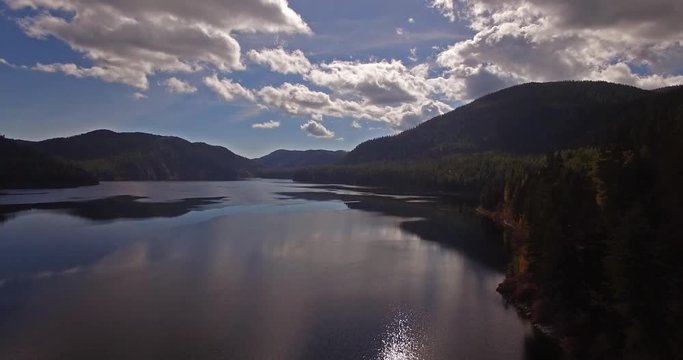 Aerial Drone Shot in Montana on a lake with a boat in the Fall or Autumn
