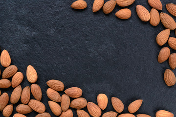 Almonds on the slate. Space for text
