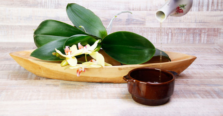 Orchids in a wooden bowl